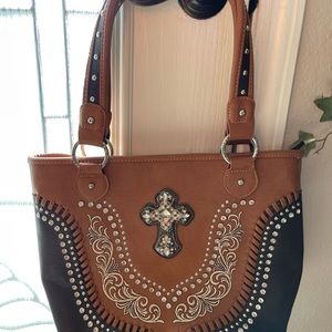 Montana west American bling purse.  New… color is brown with black trim.